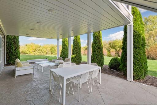 Outdoor dining space sits on the lower patio