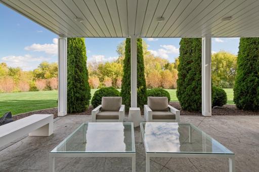 Evergreens frame the backdrop from the patio with the fiery willows in the background