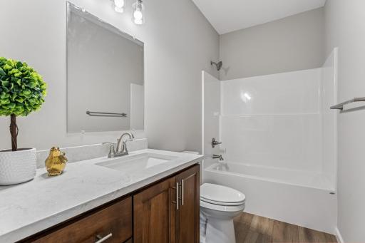 Raised vanity and toilet with deep, upgraded tub all included