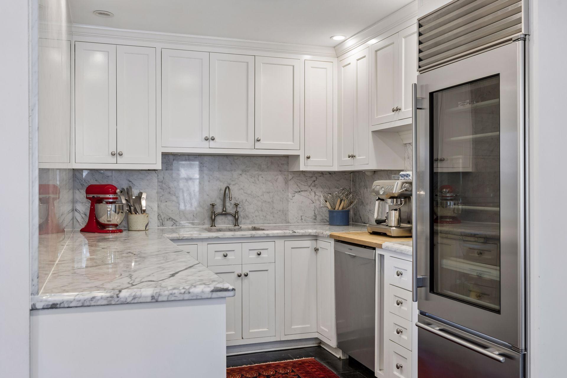 Butler’s pantry and secondary prep area connect effortlessly to the main kitchen, offering added storage, workspace, and flexibility.
