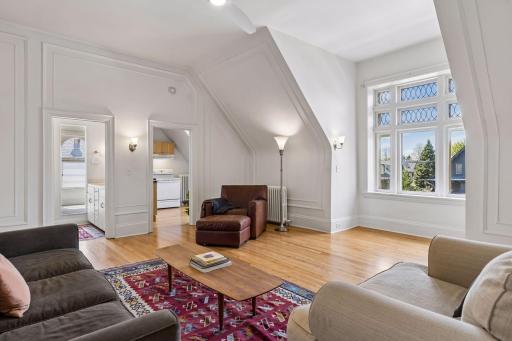 Bright third-level living room with an open, airy feelâcreating a comfortable central space that ties the level together.