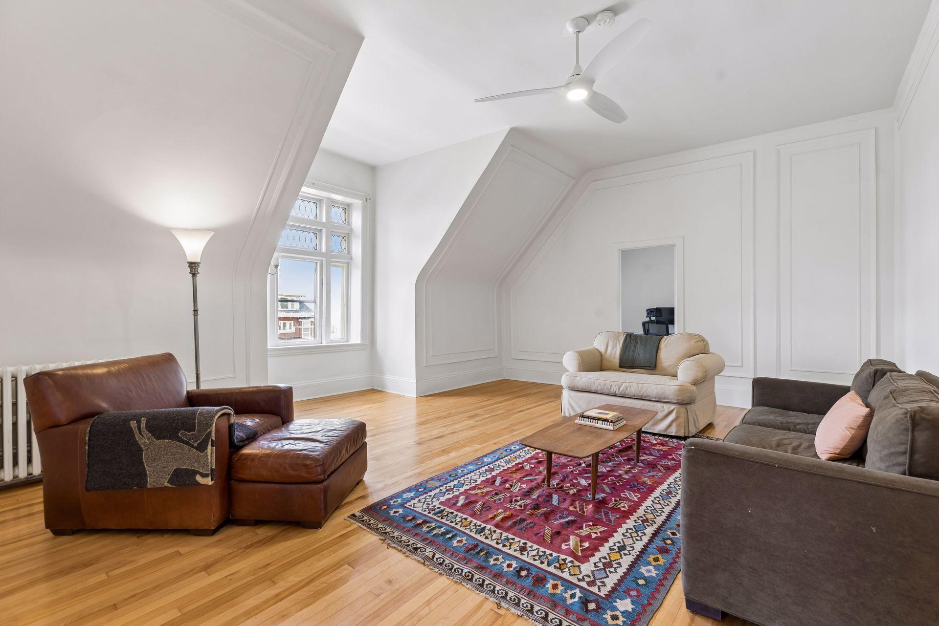 The third floor includes three bedrooms, an office with a closet, two bathrooms, and its own kitchen, ideal as an in-law suite, private guest quarters, or a fully independent rental unit.