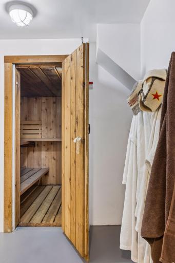 Cedar sauna creating a warm, spa-like retreat for relaxation and wellness.