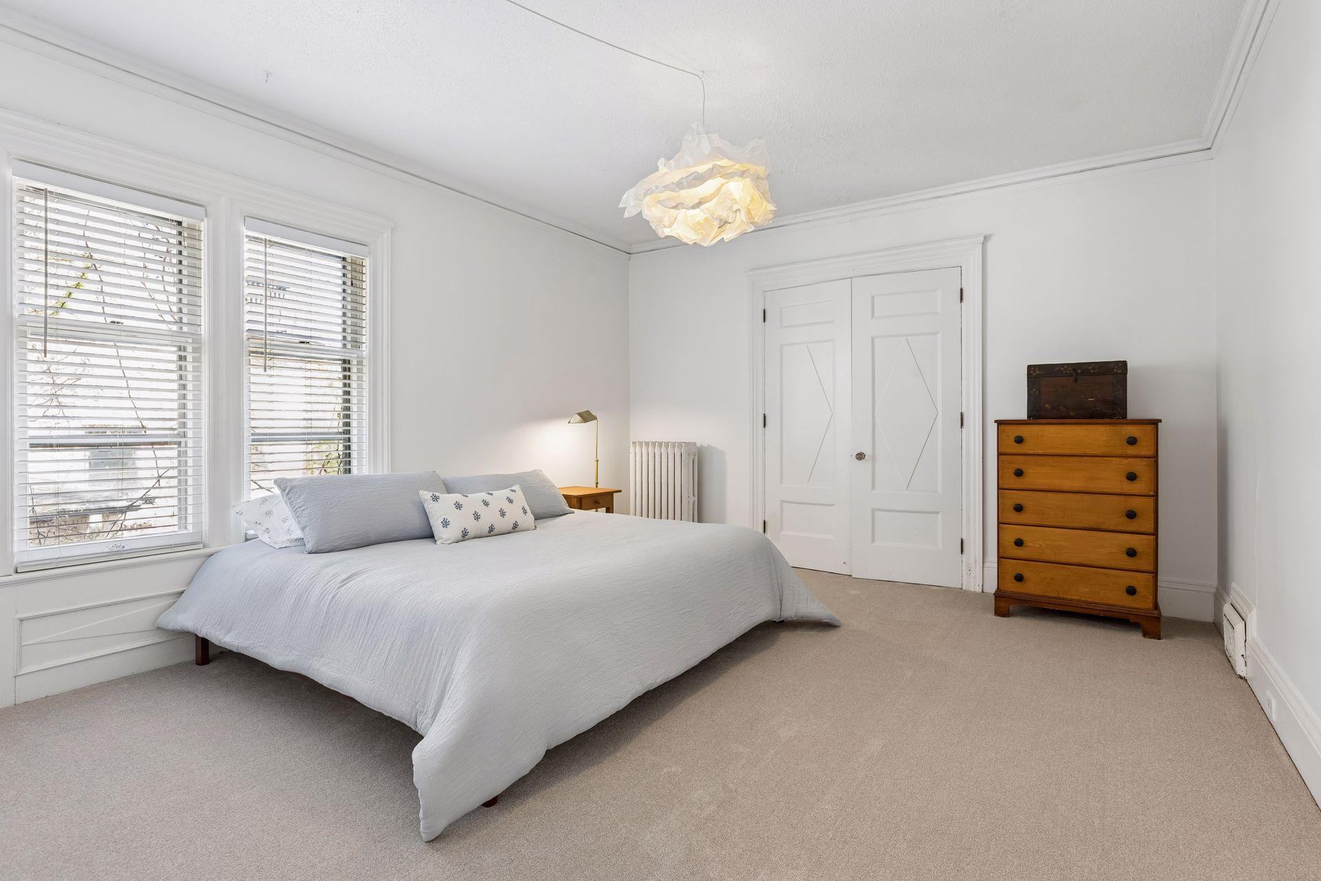 Two additional bedrooms and a thoughtfully designed three-quarter bath complete the second level.
