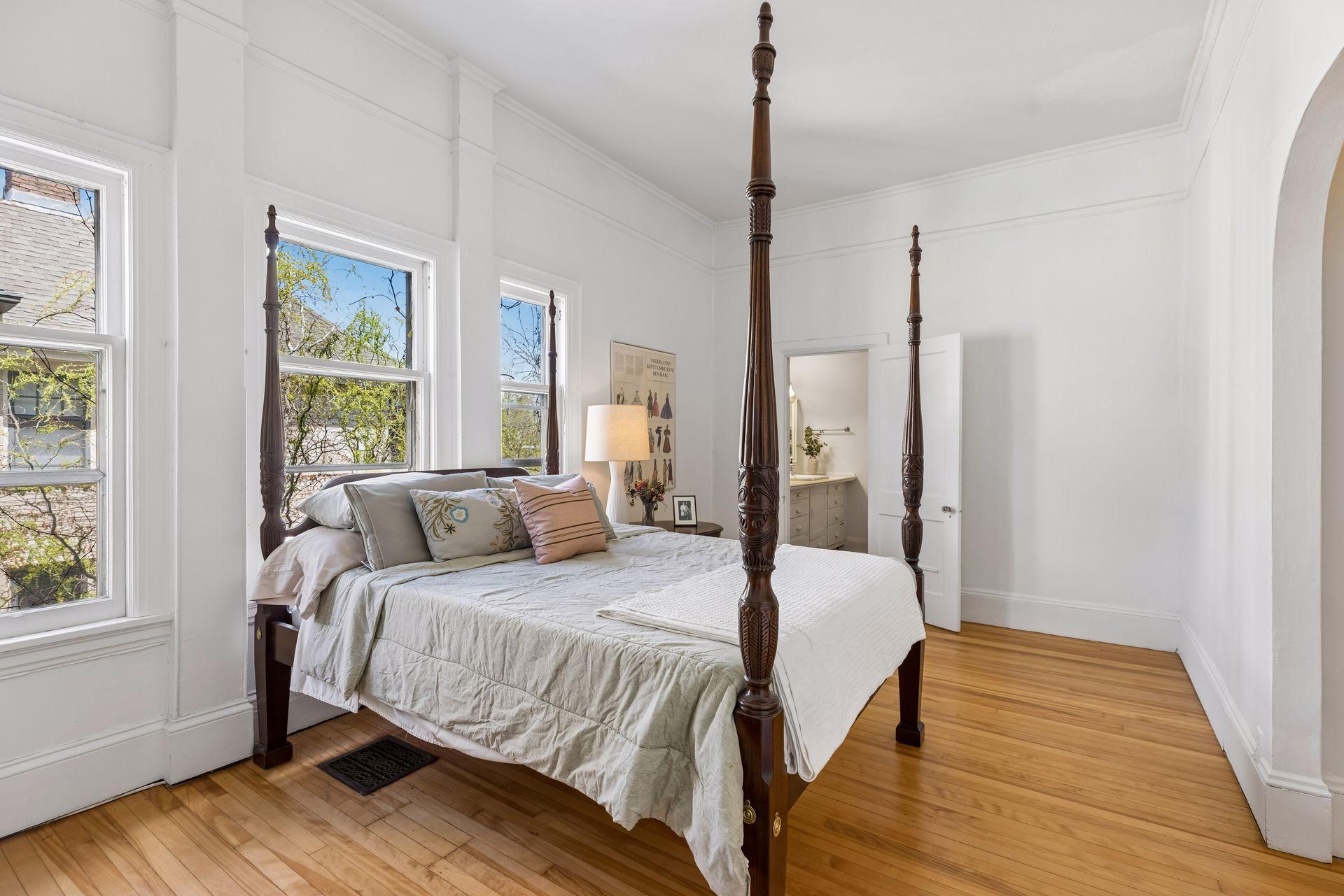 Generous third-level bedroom filled with natural light, complete with an attached full bathroom for added comfort and privacy.