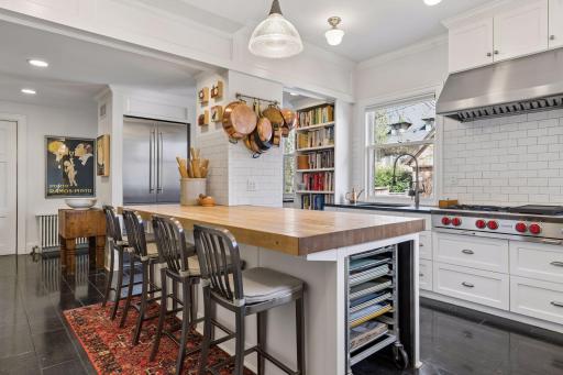 Complete with custom designed Blue-Star double wall ovens with pizza stone, two Bosch dishwashers, two high-end refrigerators (Liebherr and Subzero brands), marble countertops and butcher block center island, and Blue-Star gas range with Prizer Hood.