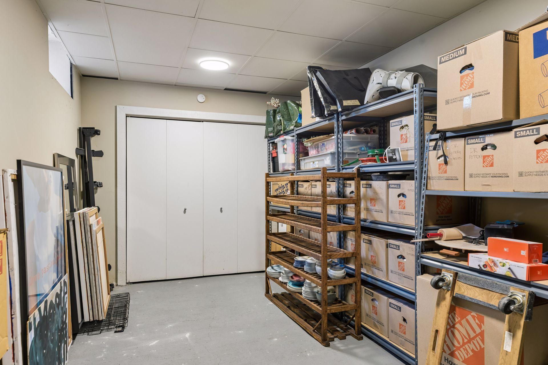 Lower level includes multiple storage rooms and a dedicated laundry area, offering ample space and organization.