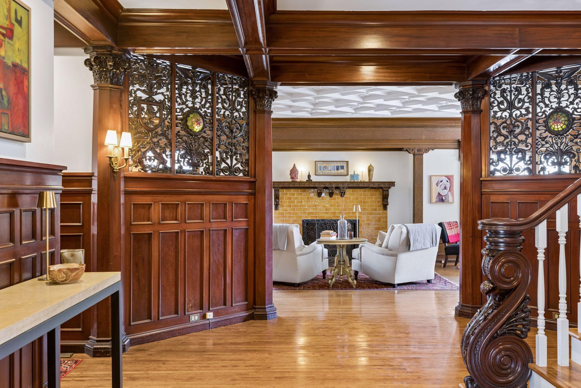 Expansive main-level living space highlighted by rich original millwork, coffered ceilings, and beautifully maintained hardwood floors. Thoughtfully open and connected, this area offers both everyday functionality and an ideal flow for entertaining.