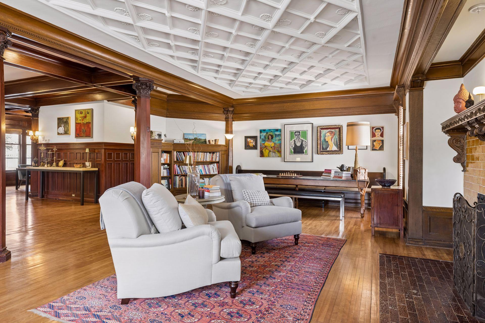 Inviting main-level living space anchored by a beautifully detailed ceiling and a statement fireplace. Open yet defined, this area offers a warm, flexible setting for both relaxed living and effortless entertaining.