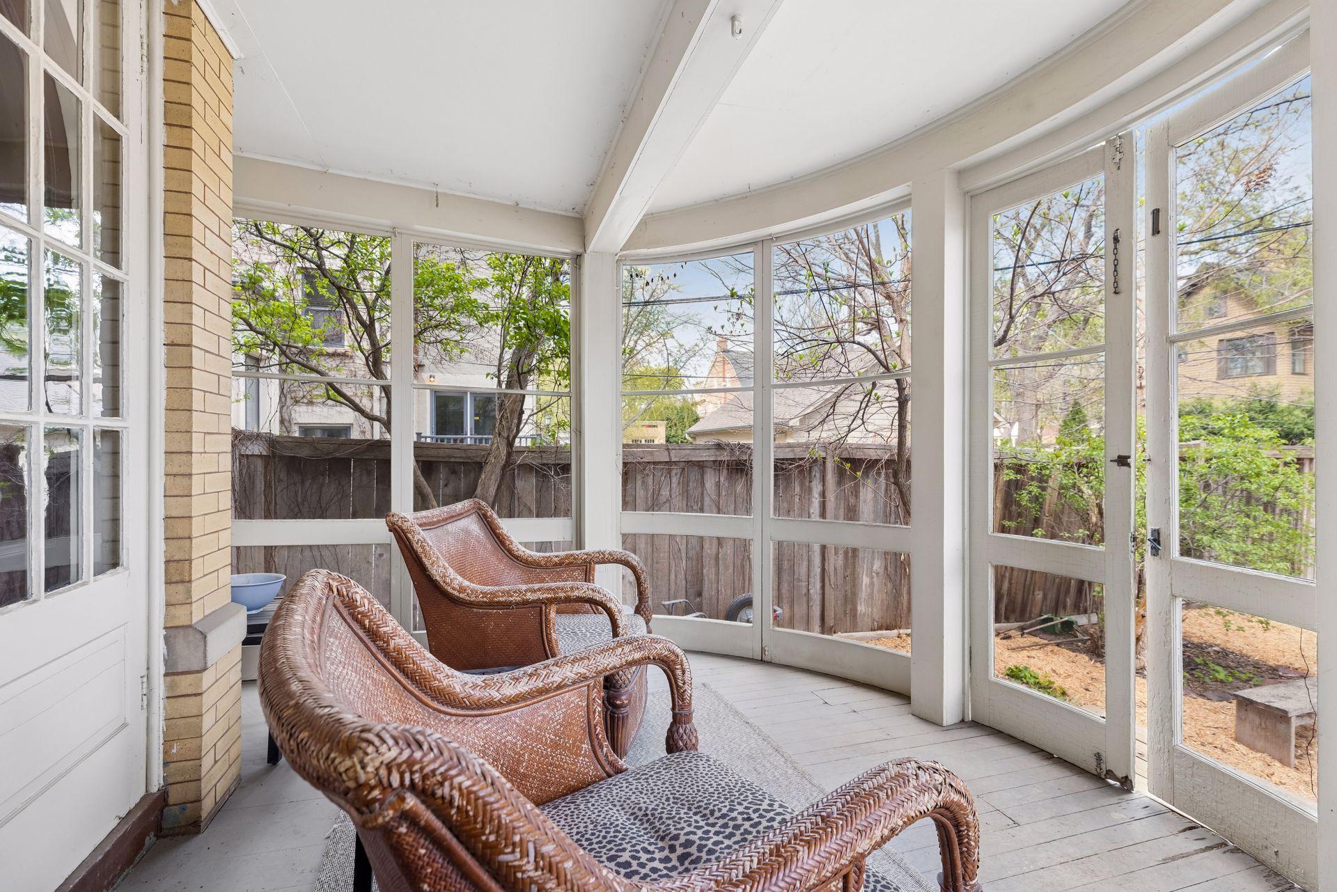 Screened-in back porch overlooking the backyard, complete with a fenced dog run. Offers multiple access points, including beautiful French doors to the dining room and a convenient entry into the home—ideal for seamless indoor-outdoor living.