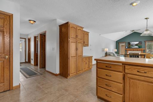 Entry Hallway Boasts a 4 x 8 Closet, 1/2 Bath and Laundry Room with Garage Access.