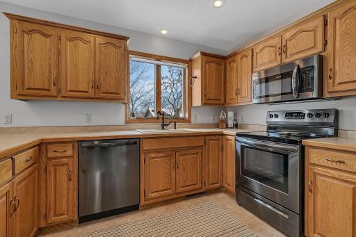 Spotless! Updated Sink/Faucet and Appliances. Kitchen Window Offers Views of Back Yard Space