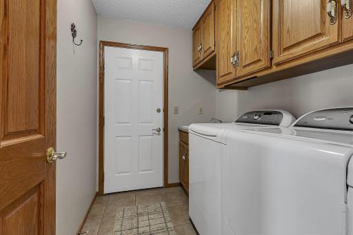 Laundry Room Leads to Finished and Heated Garage - Laundry Sink and Cabinetry Finishes this Space