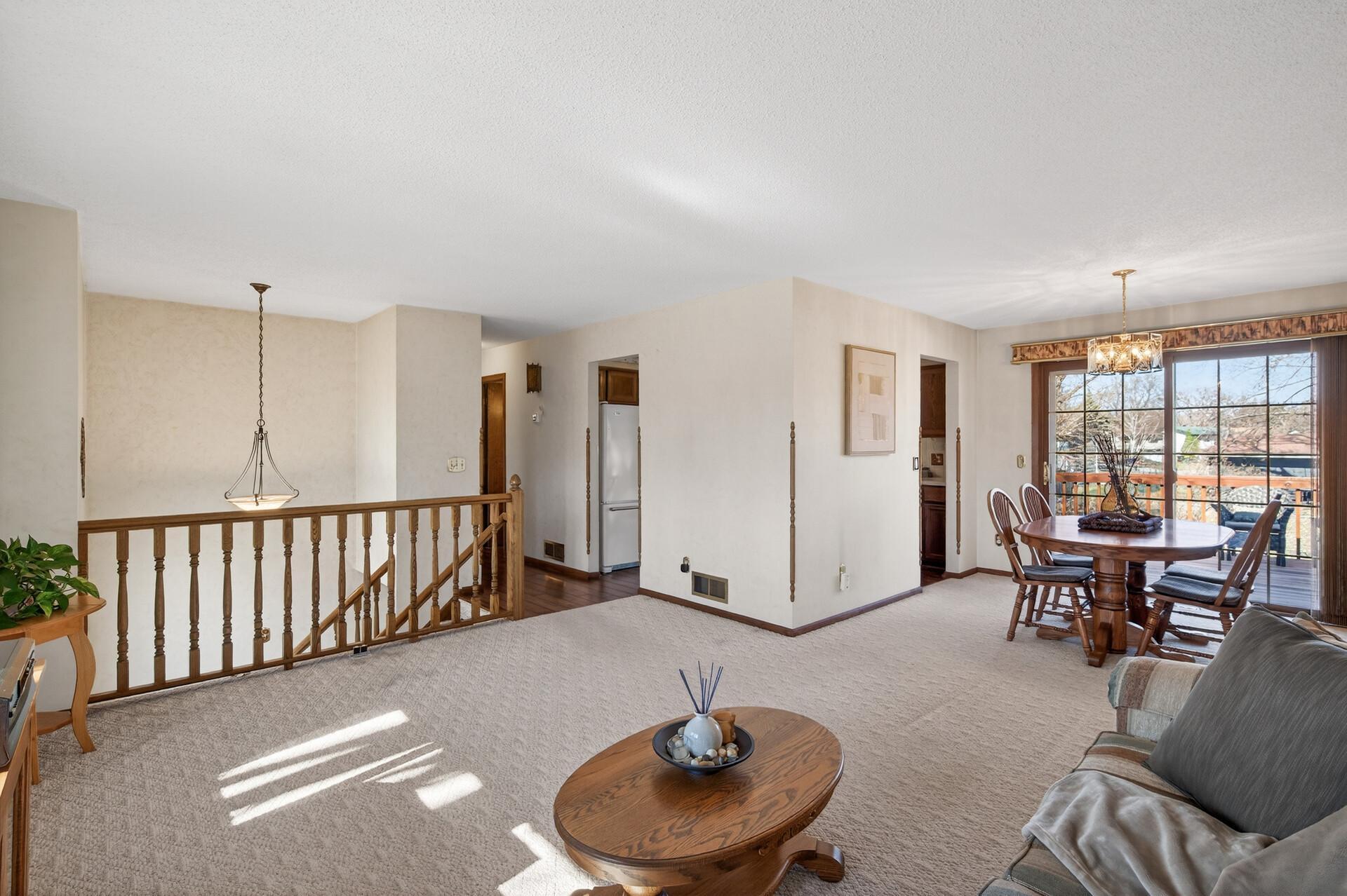 The living space provides a great view of both the front and back yards. Neutral walls and carpet easily support your own personal style.