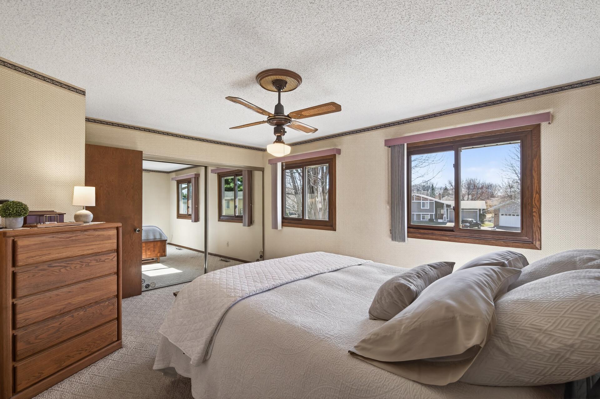 Mirrored closed doors enhance the space & the ceiling fan provides all year comfort.
