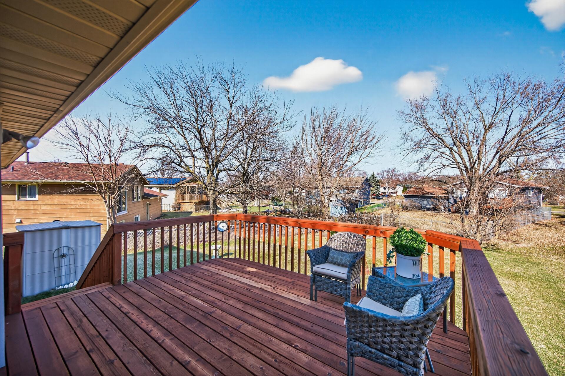 Enjoy morning coffee basking in the sun on your spacious deck with stairs to the backyard.