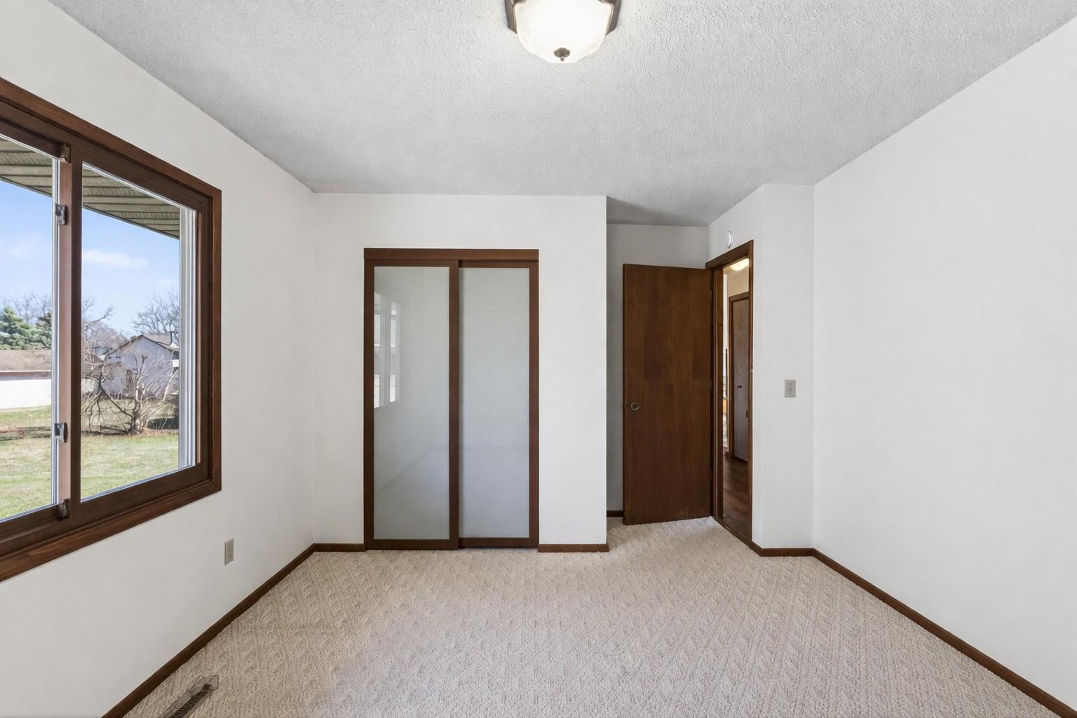 Bedroom 2 with custom closet doors, fresh paint & clean carpets.