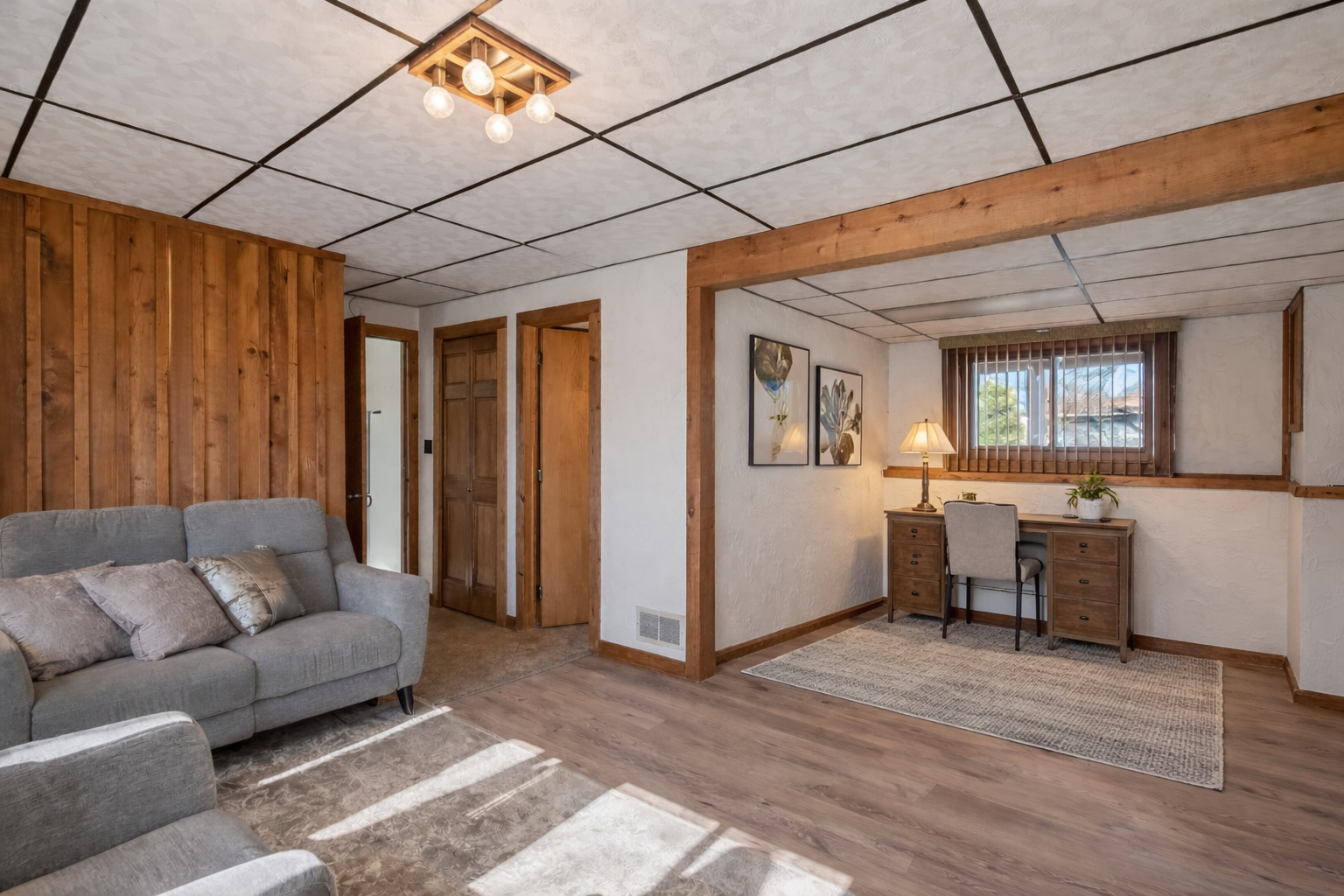 This extended area in the lower level could serve as a perfect home office space. This photo was virtually staged removing a small wet bar currently on the left wall to show you the possibilities!