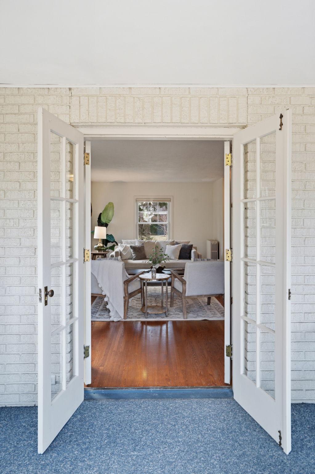 Living room can be connected with porch via French doors