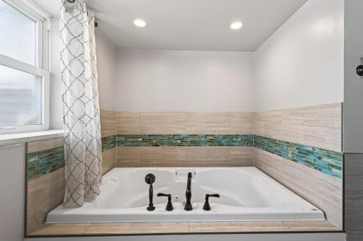 Feel like you are on vacation while soaking in this fantastic tub