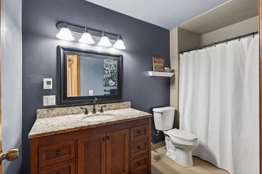 The upper level bathroom features tiled floors, tiled shower and IN FLOOR HEAT!