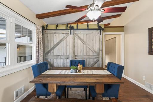 The barn doors aren't just decorative, they house a massive pantry for all your storage needs