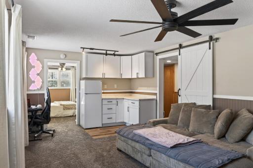The lower level family room as a kitchenette space