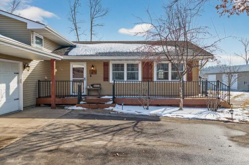 Such an inviting front porch to relax and take in the beauty that surrounds you at this amazing property
