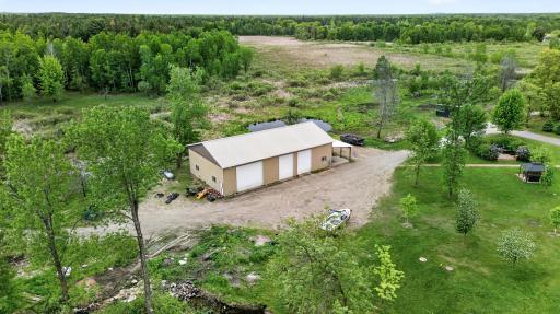 Expansive 40x72ft pole building with 16ft side walls and 14ft high garage doors. 40x40ft has concrete, electricity, is insulated and heated too. There is also a 16x40ft loft in the upper level.