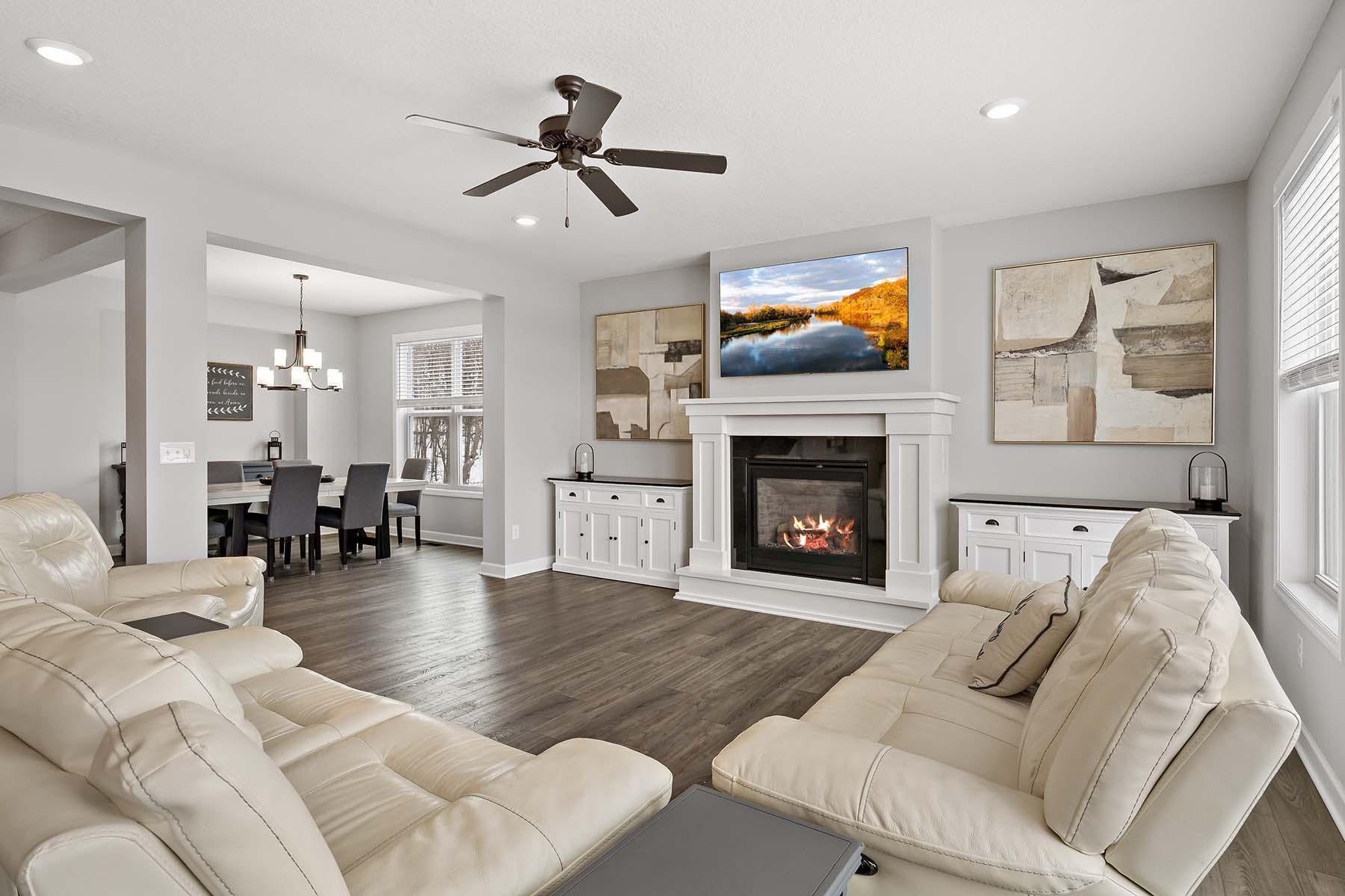 This comfortable yet stylish space is perfect for relaxing with a cozy gas burning fireplace and allows a seamless connection to the surrounding living areas.
