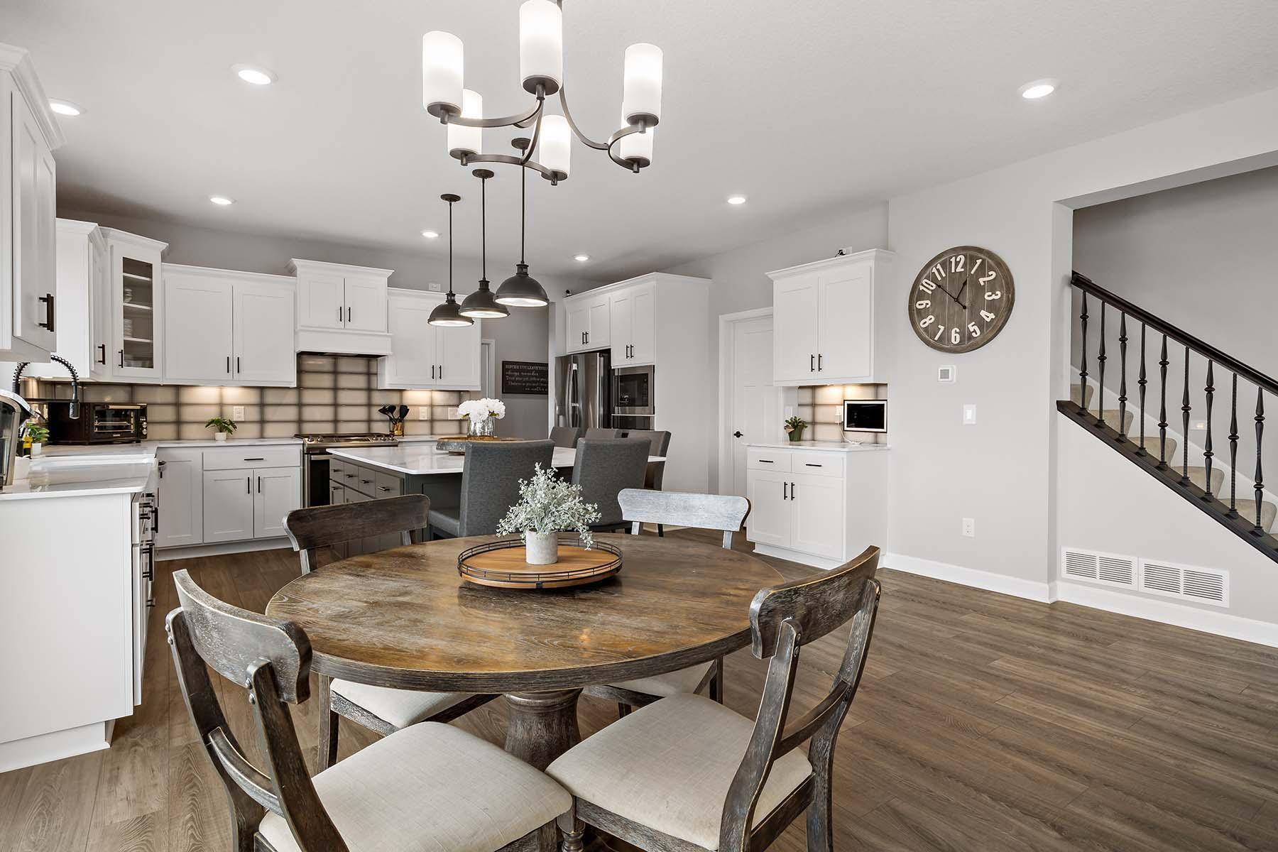 The dinette offers a bright, casual dining space just off the kitchen, perfectly positioned for everyday meals. Direct patio door access to the new composite deck offers a seamless blend of indoor and outdoor living.