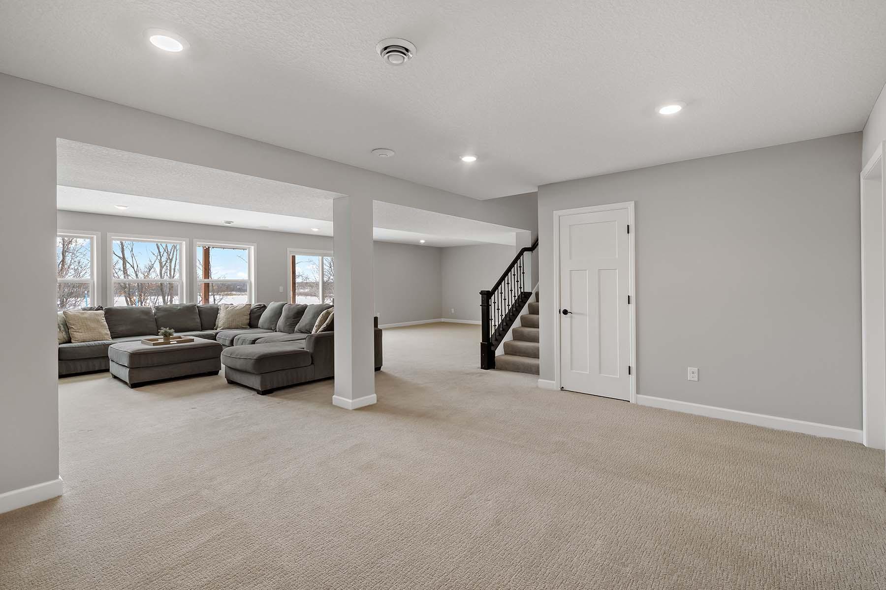 Lower-Level Recreation Room – A spacious 16×12 area designed for both fun and flexibility, enhanced by recessed lighting that keeps the room bright and inviting.