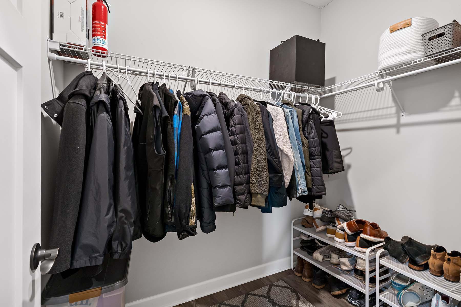 Conveniently located just off the garage, this spacious closet is perfect for keeping clutter out of sight while maintaining easy access to everything you need.