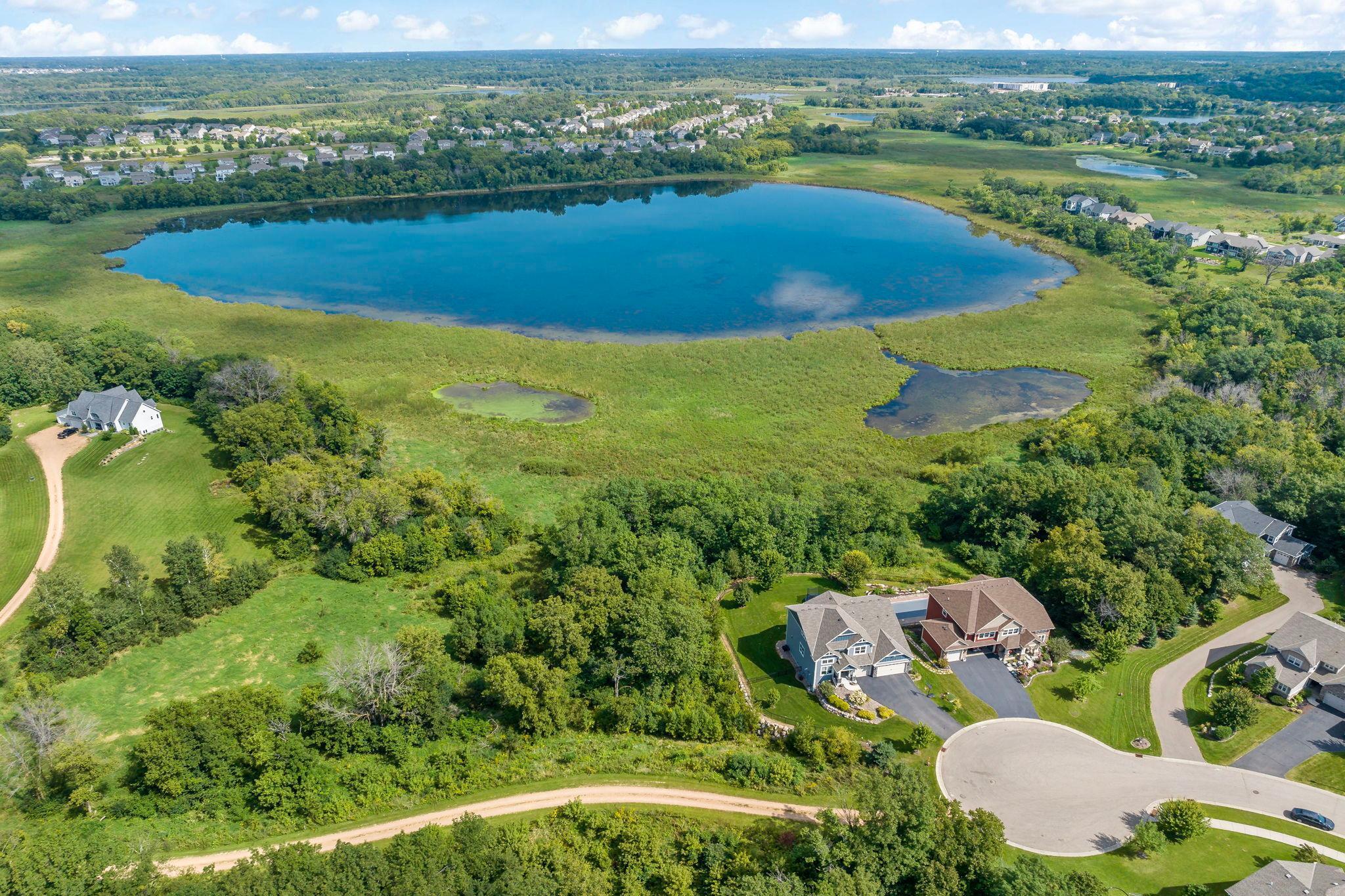 Perfectly positioned on a quiet cul-de-sac, the natural lake and surrounding wetlands, mature trees, and open green space create a serene backdrop with a sense of privacy, while still being part of a well-established neighborhood.