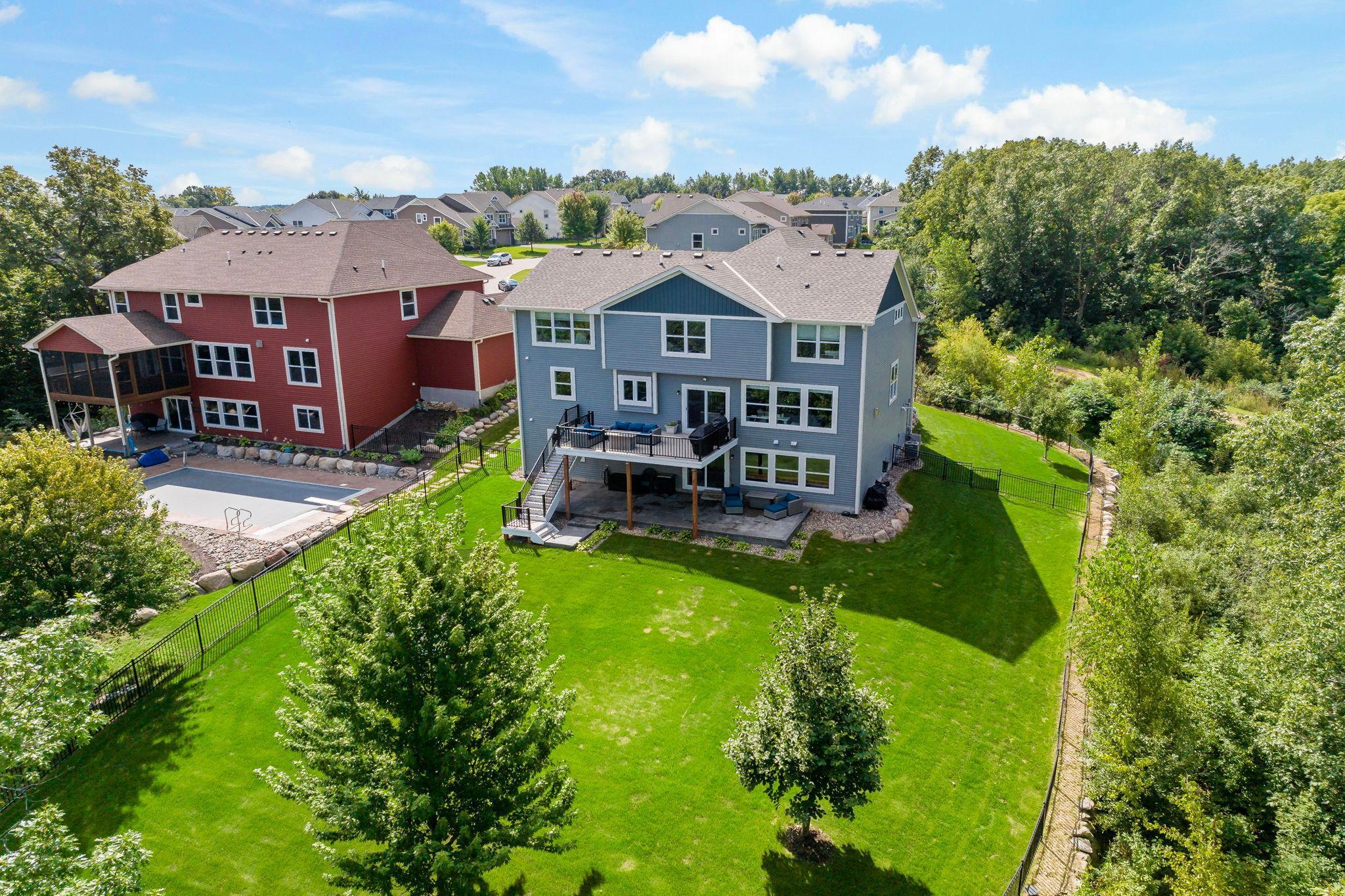 Set on a beautifully maintained lot, this home offers a spacious backyard with lush green lawn and mature trees, creating a peaceful and private setting.