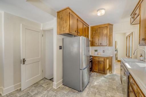 The kitchen has been updated with new stainless steel refrigerator, range, and dishwasher.