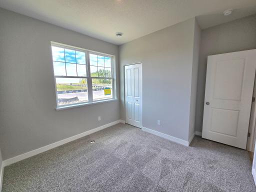 Harmony Bedroom 2. Photos are of actual home. Colors and options may vary. Ask Sales Agent for details.