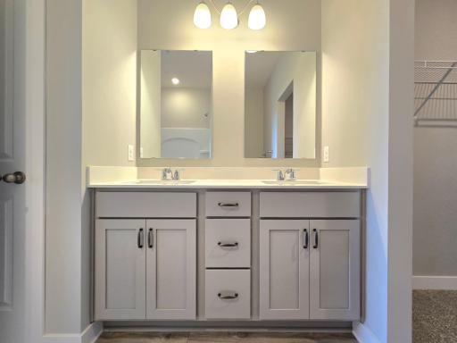 Harmony Primary Bathroom with dual sinks. Photos are of actual home. Colors and options may vary. Ask Sales Agent for details.