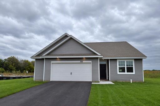 The Harmony American Classic at Highlands at Eagle View in Elko New Market. Photo is of actual home. Options and colors may vary. Ask Sales Agent for details. AI-generated landscaping for visualization. Actual yard condition may differ.