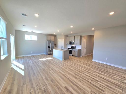 Harmony Kitchen open onto Living and Dining Rooms. Photos are of actual home. Colors and options may vary. Ask Sales Agent for details.