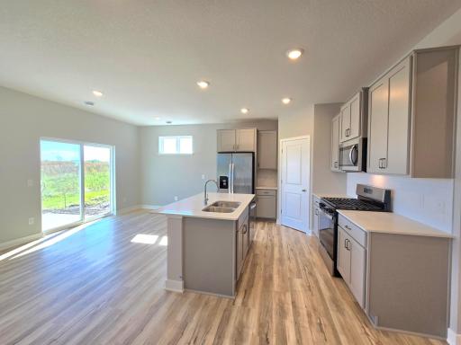 Harmony Kitchen and dining area. Photos are of actual home. Colors and options may vary. Ask Sales Agent for details.