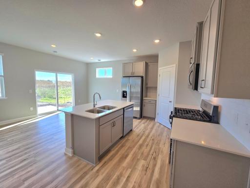 Harmony Kitchen and dining area. Photos are of actual home. Colors and options may vary. Ask Sales Agent for details.