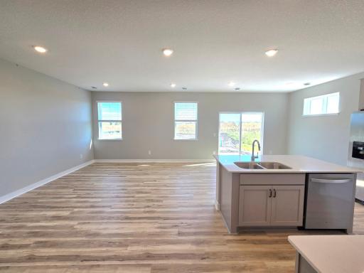 Harmony Kitchen open onto Living and Dining Rooms. Photos are of actual home. Colors and options may vary. Ask Sales Agent for details.