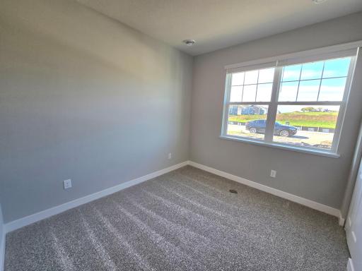 Harmony Bedroom 2. Photos are of actual home. Colors and options may vary. Ask Sales Agent for details.