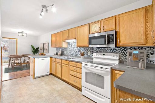 Wonderful kitchen with an abundance of cabinets and counter space and a convenient breakfast bar area.