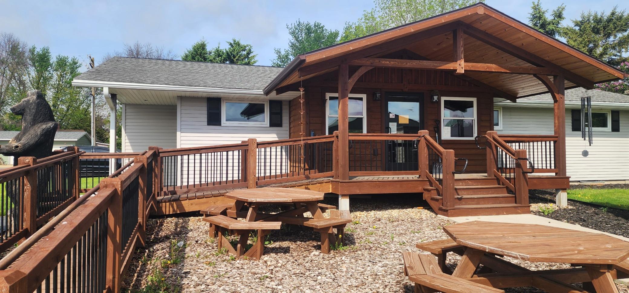 The current owners have added on the covered porch and the ADA approved ramp access
