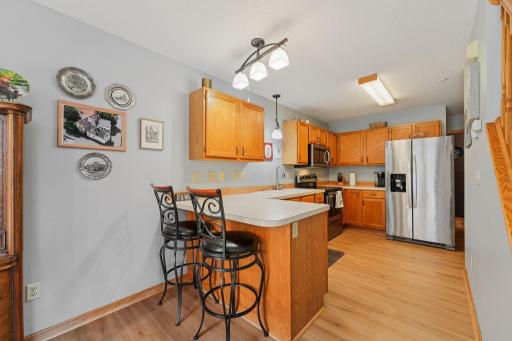 Enjoy an open kitchen featuring ample counter space and a generously sized pantry just around the corner.