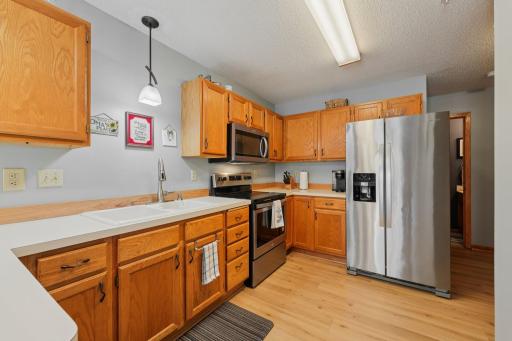 Newer kitchen flooring with stainless steel appliances
