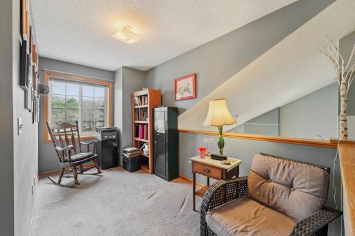 The loft area offers an ideal space for a home office.