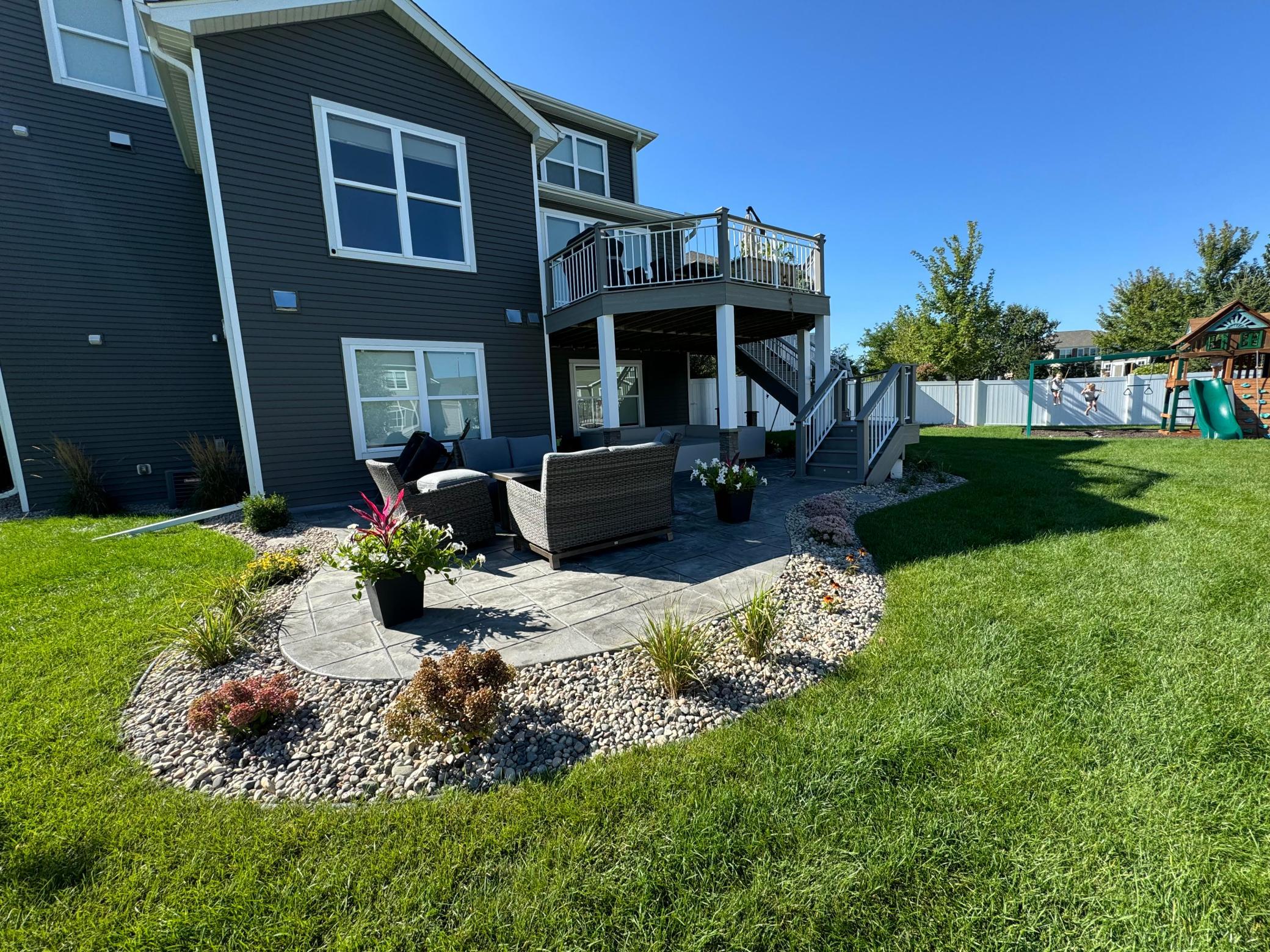 Half acre lot with large patio, privacy fence, shed, and deck